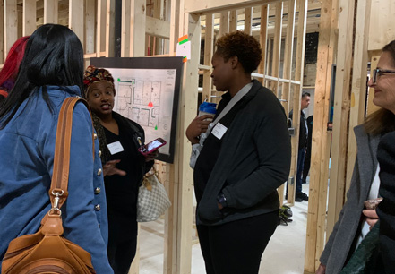 Women at a construction site talking.