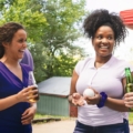 Women outside enjoying a BBQ.