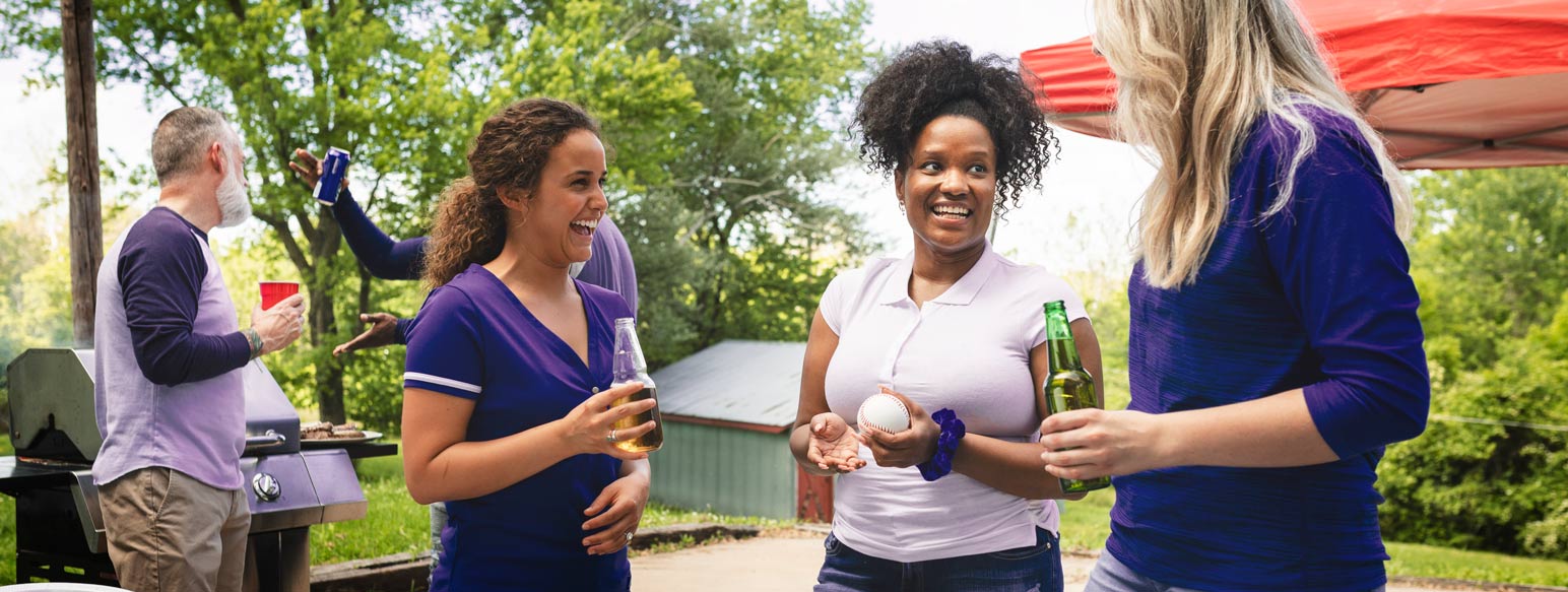Women outside enjoying a BBQ.
